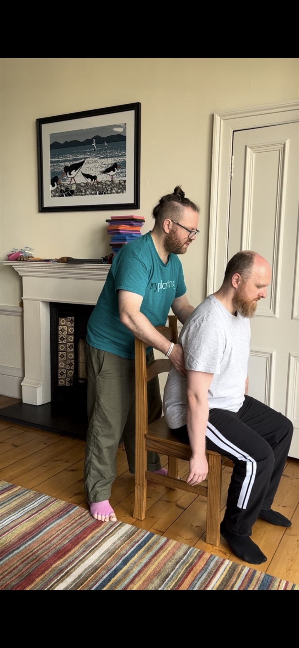 An Alexander Technique lesson: gentle hands-on guidance with a seated student